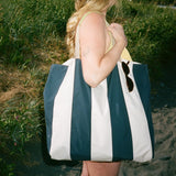 Close-up of striped Shore Carryall worn over the shoulder